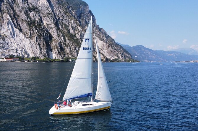 Sailing Experience on Lake Como: Fun, Relax and Adventure! - Steering at the wheel: the captain-for-a-day moment